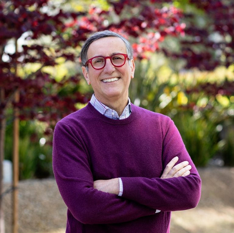 LJI Professor Alessandro Sette, Dr.Biol.Sci., stands outside the Institute