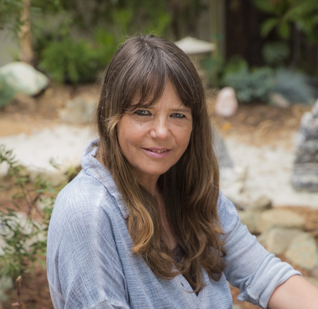 Photo portrait of Dr. Cheroutre. She is outside and looking at camera