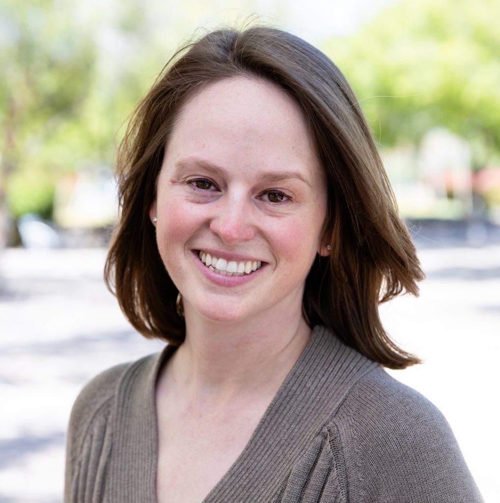 Portrait photo of Helms. She is facing the camera and smiling