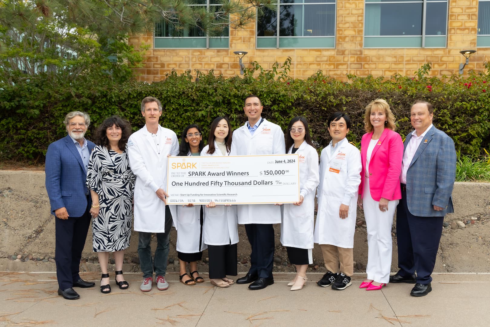 Left to right: Tom and Judy Tullie, alongside 2024 SPARK winners Thomas Riffelmacher, Ph.D., Rimjhim Agarwal, Jingru Fang, Ph.D., Isaac López-Moyado, Ph.D., Chen Sun, Ph.D., and Kazumasa Suzuki, M.D., Ph.D., as well as Brenda and Dave Rickey