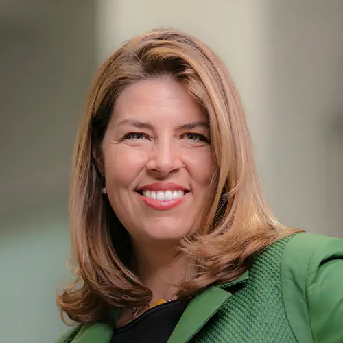 Portrait photo of Dr. Saphire. She is wearing green and smiling at the camera