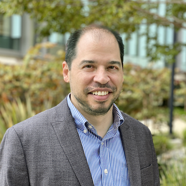 Photo portrait of Richard Stryjewski. He is standing outside at smiling at the camera