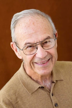 Portrait photo of Howard Grey. He is smiling and looking at the camera