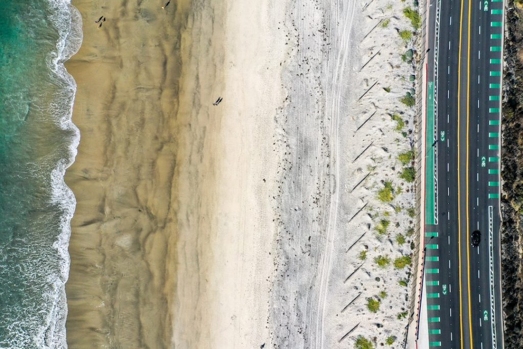 Drone shot of a San Diego beach. Photo by Dawid Zyla.